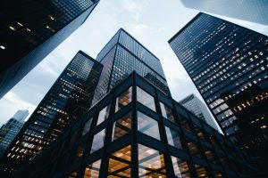 Low-angle view of glass office towers in a downtown business district